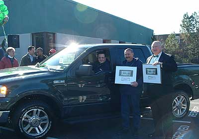 The winners pose with the new green F-150